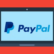 Schéma d'un ordinateur ouvert sur le logo de PayPal.