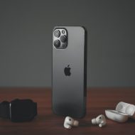 An iPhone, Apple Watch and AirPods.