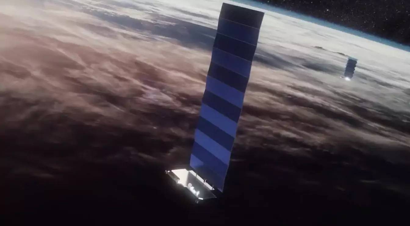 Vision d'artiste de satellites Starlink en orbite.