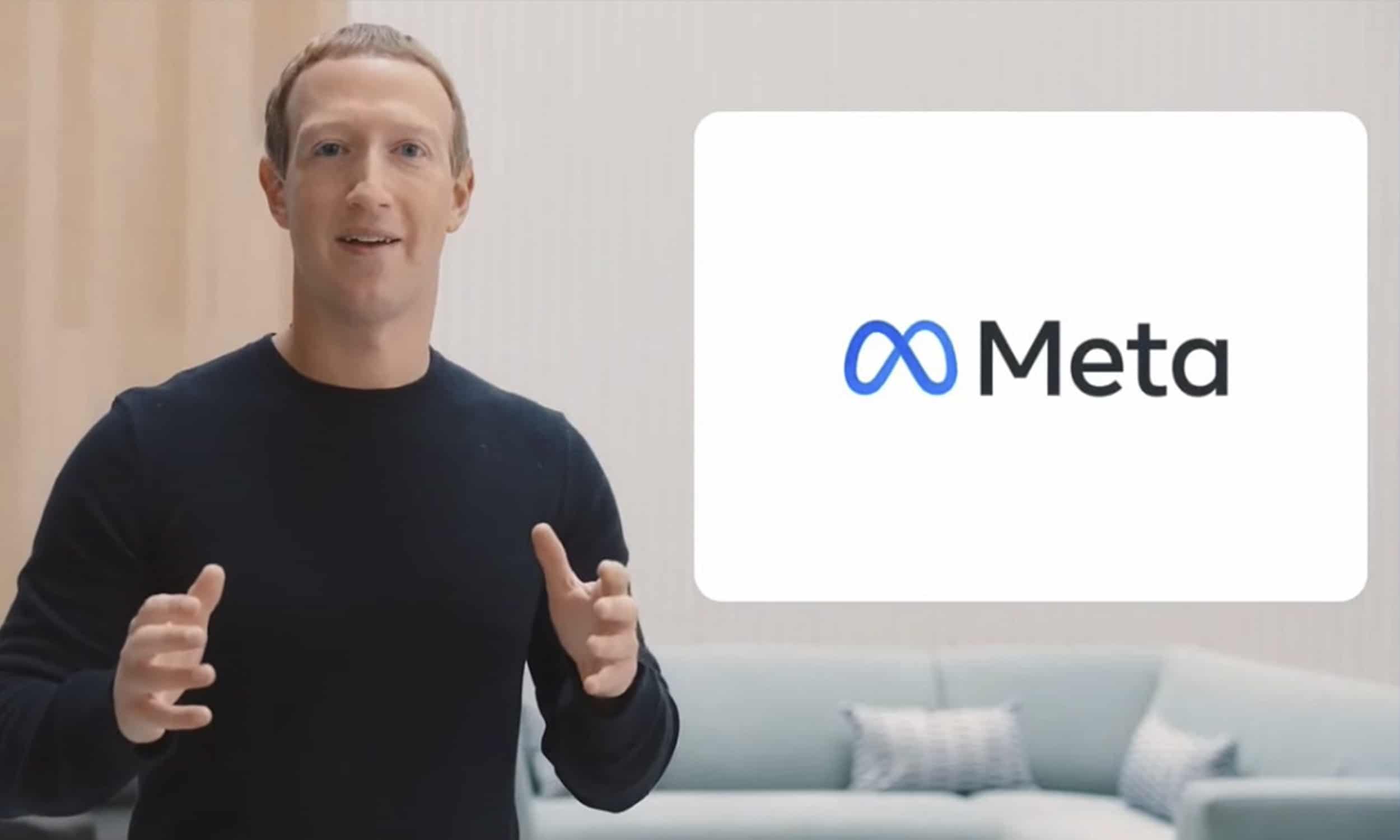 Mark Zuckerberg devant le logo de Meta.