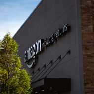 Amazon logo on a warehouse.