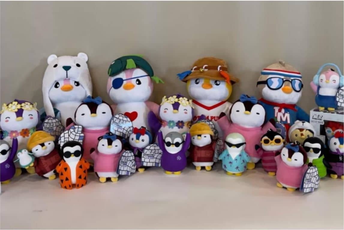 Series of stuffed animals representing masked penguins.