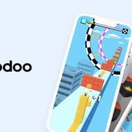 Logo de Voodoo ainsi que trois smartphones superposés les uns sur les autres.